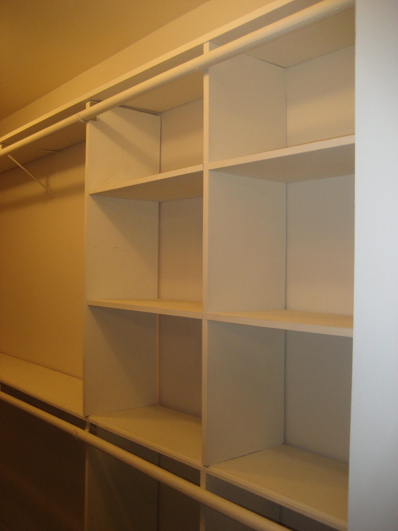 A Jones For Organizing How To Transform Your Exasperating Closet Closet With Rod Going Across Built In Cubbies
